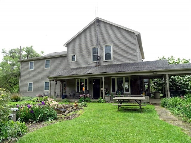 518 Hill St, Coshocton, OH 43812 - back of house featuring a yard