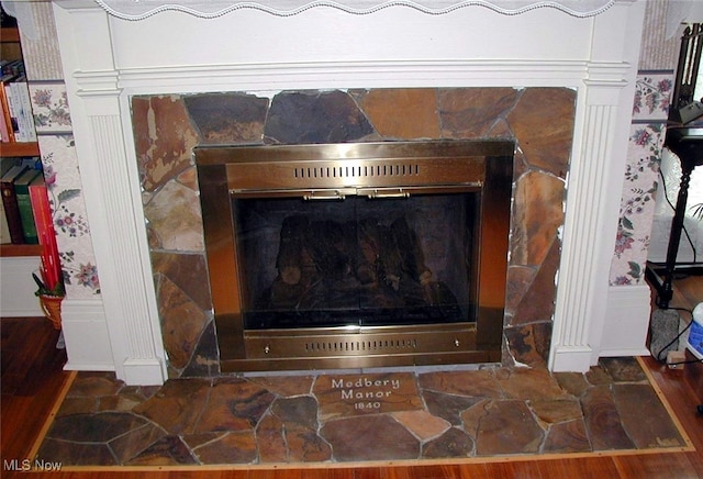 518 Hill St, Coshocton, OH 43812 - detailed view of a fireplace and wood finished floors