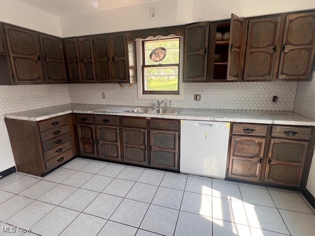 296 Sanderson Ave, Campbell, OH 44405 - kitchen featuring white dishwasher, a sink, decorative backsplash, and light countertops
