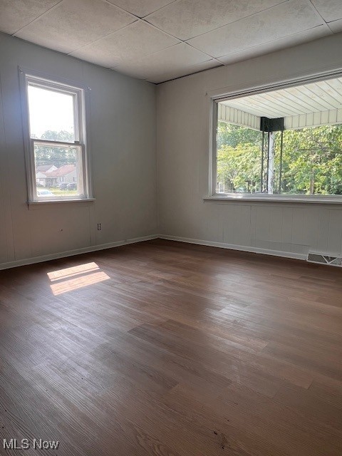 296 Sanderson Ave, Campbell, OH 44405 - unfurnished room with dark wood-style flooring, healthy amount of natural light, and baseboards