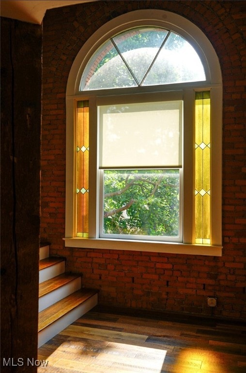 2337 W 11th St Unit 6, Cleveland, OH 44113 - detailed view of wood finished floors, brick wall, and arched walkways