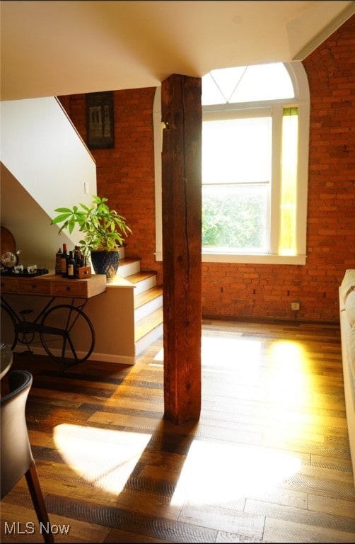 2337 W 11th St Unit 6, Cleveland, OH 44113 - hall with wood finished floors and brick wall