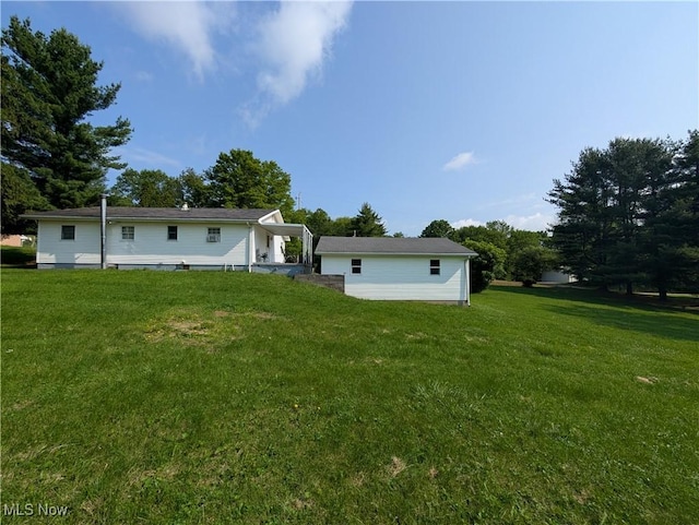 5710 Sugargrove Rd, Blue Rock, OH 43720 - rear view of property with a yard