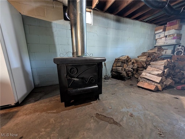 5710 Sugargrove Rd, Blue Rock, OH 43720 - unfinished basement featuring a wood stove