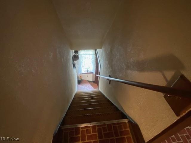 705 Main St, Toronto, OH 43964 - staircase featuring brick patterned flooring