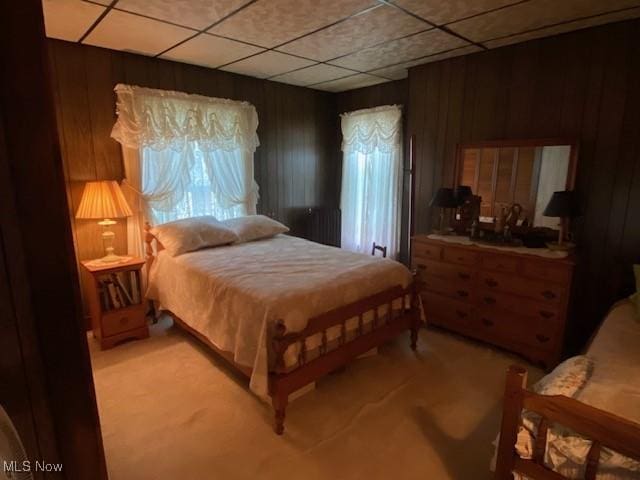 705 Main St, Toronto, OH 43964 - bedroom with light carpet, wood walls, and a paneled ceiling