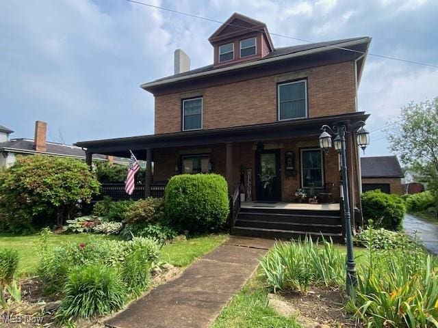 705 Main St, Toronto, OH 43964 - view of front facade with covered porch and brick siding