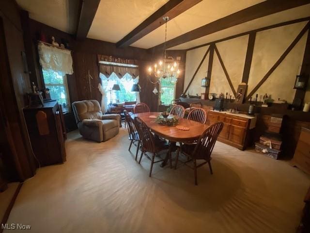 705 Main St, Toronto, OH 43964 - dining space featuring a chandelier, beam ceiling, and light carpet