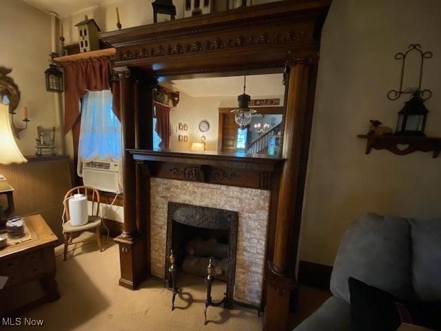 705 Main St, Toronto, OH 43964 - living area featuring cooling unit, a fireplace, and carpet