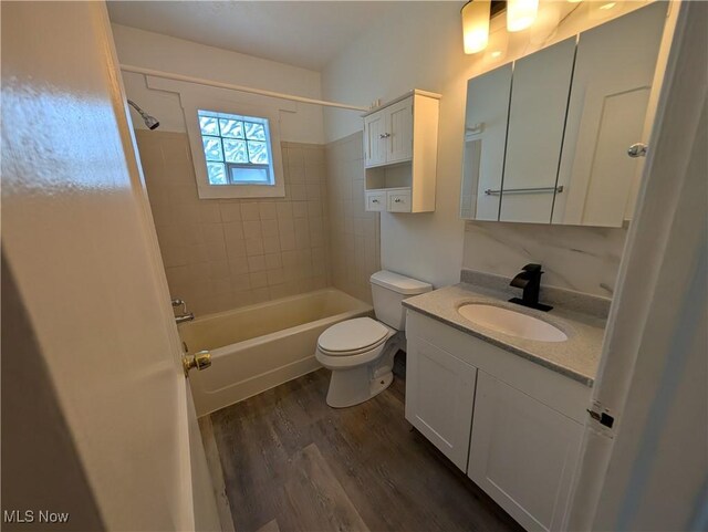 727 N Firestone Blvd, Akron, OH 44306 - bathroom featuring wood finished floors, vanity, tub / shower combination, and toilet