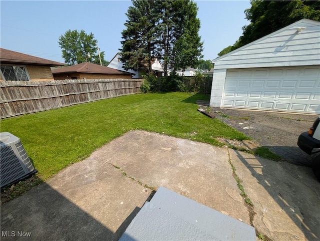 727 N Firestone Blvd, Akron, OH 44306 - view of yard with central AC, an outdoor structure, and a garage