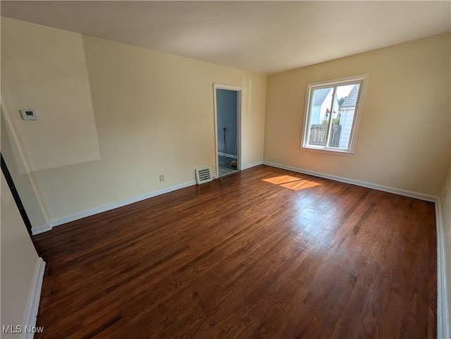 727 N Firestone Blvd, Akron, OH 44306 - empty room with dark wood finished floors and baseboards