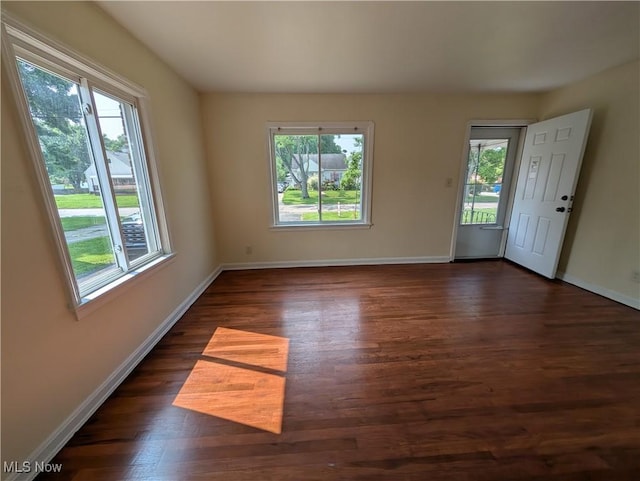 727 N Firestone Blvd, Akron, OH 44306 - spare room with healthy amount of natural light, dark wood-type flooring, and baseboards