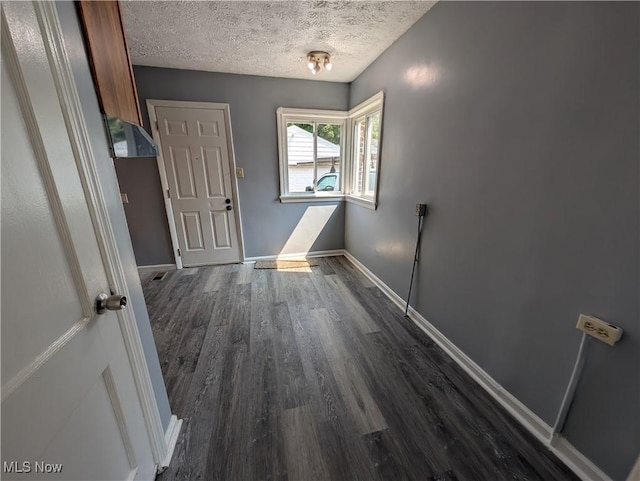 727 N Firestone Blvd, Akron, OH 44306 - unfurnished room featuring dark wood finished floors, a textured ceiling, and baseboards
