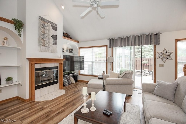 2401 Bunker Ln Unit B, Willoughby, OH 44094 - living area featuring wood finished floors, a ceiling fan, plenty of natural light, lofted ceiling, and built in features