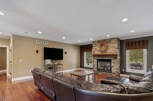 8320 Westfield Rd, Seville, OH 44273 - living room with ornamental molding, recessed lighting, baseboards, wood finished floors, and a fireplace