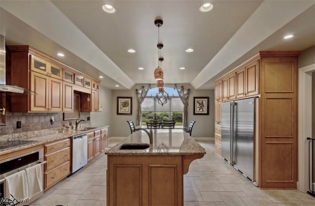 8320 Westfield Rd, Seville, OH 44273 - kitchen featuring appliances with stainless steel finishes, baseboards, a center island with sink, light stone countertops, and recessed lighting