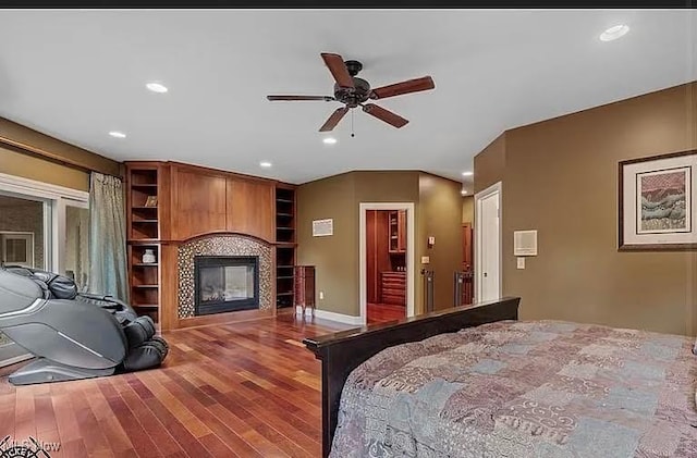 8320 Westfield Rd, Seville, OH 44273 - bedroom with a glass covered fireplace, wood finished floors, recessed lighting, and baseboards