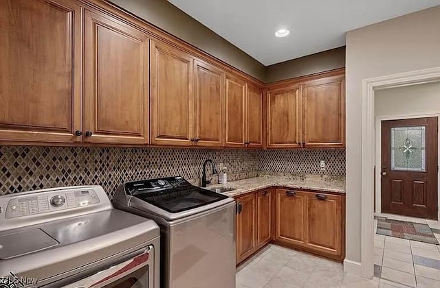 8320 Westfield Rd, Seville, OH 44273 - washroom featuring cabinet space, washer and dryer, and light tile patterned flooring