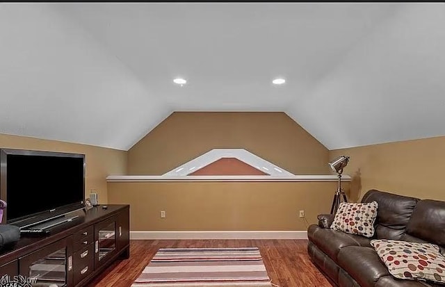 8320 Westfield Rd, Seville, OH 44273 - living room with dark wood-type flooring, lofted ceiling, baseboards, and recessed lighting
