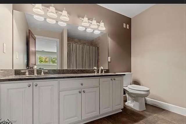 8320 Westfield Rd, Seville, OH 44273 - full bathroom featuring double vanity, toilet, tile patterned flooring, baseboards, and a shower with curtain
