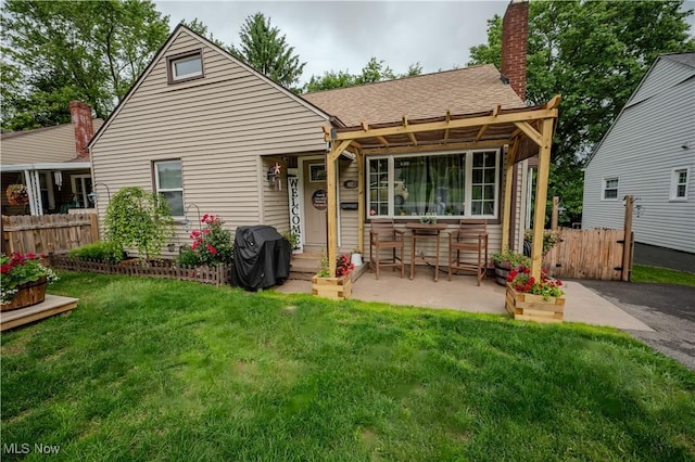627 Elson St, East Liverpool, OH 43920 - rear view of house featuring a chimney and a shingled roof