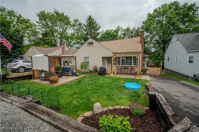 627 Elson St, East Liverpool, OH 43920 - bungalow-style house with outdoor lounge area, a patio area, and a chimney