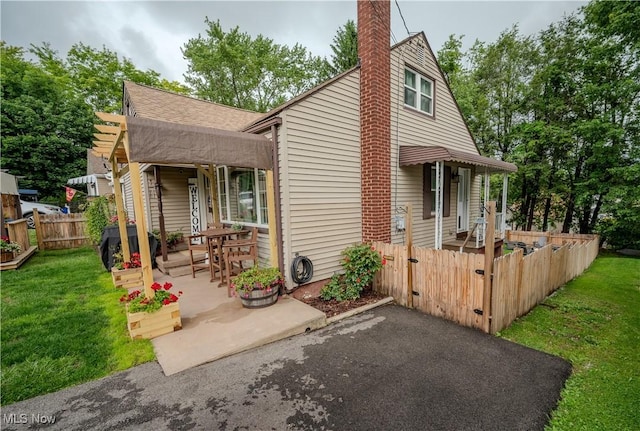 627 Elson St, East Liverpool, OH 43920 - view of front of home featuring a patio area and a chimney