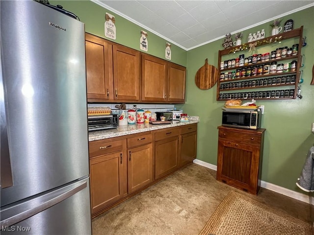 627 Elson St, East Liverpool, OH 43920 - kitchen featuring stainless steel appliances, crown molding, and brown cabinets