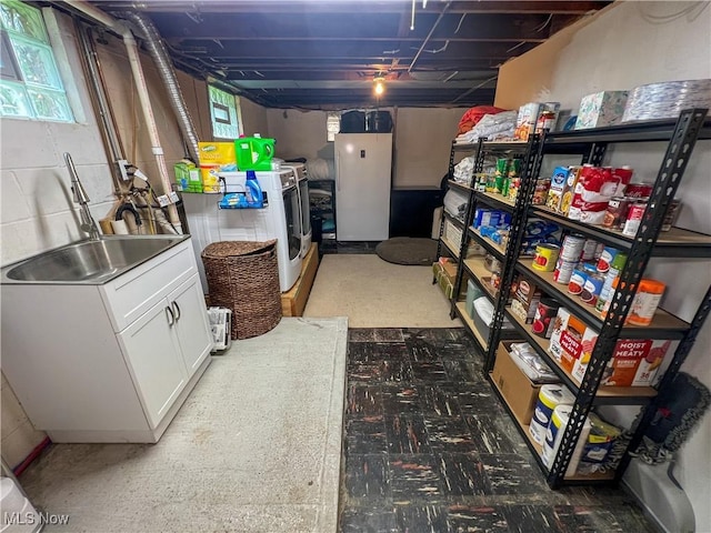 627 Elson St, East Liverpool, OH 43920 - below grade area with freestanding refrigerator and washer and clothes dryer