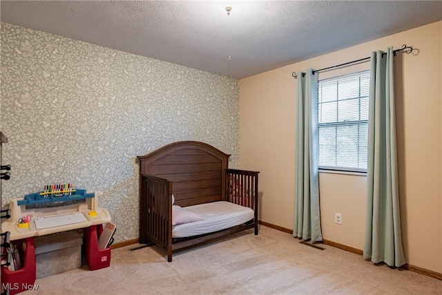 488 Maple Dr, Williamstown, WV 26187 - bedroom with wallpapered walls, carpet flooring, baseboards, and a textured ceiling