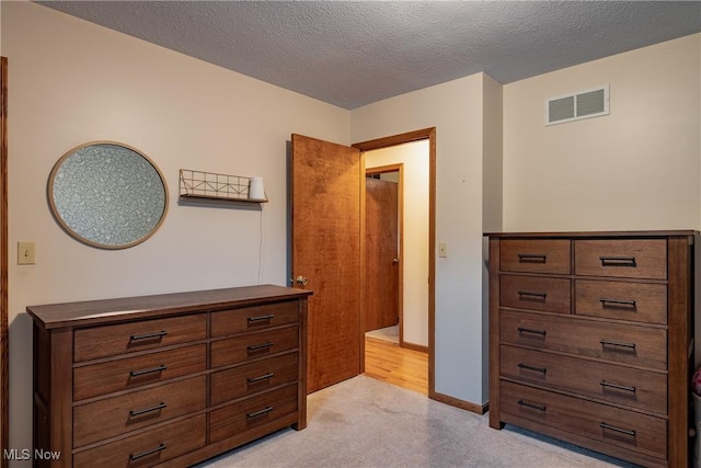 488 Maple Dr, Williamstown, WV 26187 - bedroom with light carpet and a textured ceiling
