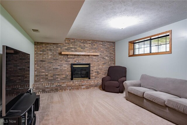 488 Maple Dr, Williamstown, WV 26187 - living room featuring carpet, a textured ceiling, and a brick fireplace