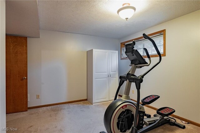 488 Maple Dr, Williamstown, WV 26187 - workout area with light carpet, baseboards, and a textured ceiling