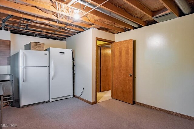 488 Maple Dr, Williamstown, WV 26187 - unfinished below grade area featuring freestanding refrigerator, carpet floors, and baseboards