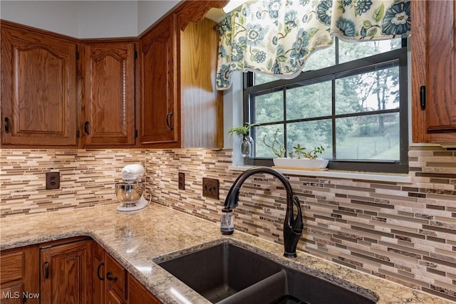 488 Maple Dr, Williamstown, WV 26187 - kitchen with a sink, tasteful backsplash, and brown cabinetry