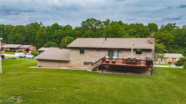 488 Maple Dr, Williamstown, WV 26187 - rear view of house with a deck, a chimney, a yard, and a view of trees