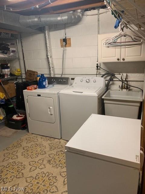 2115 Presidential Pkwy Unit B5, Twinsburg, OH 44087 - laundry room featuring cabinet space and washer and clothes dryer