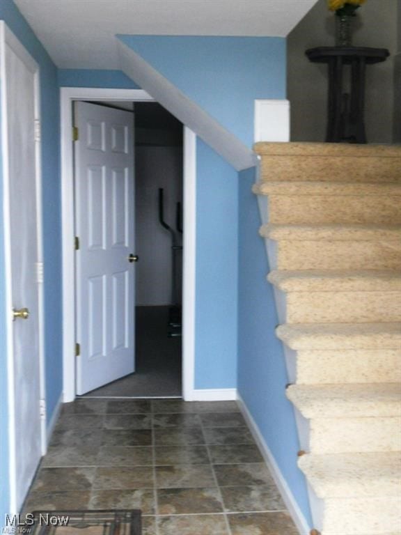 2115 Presidential Pkwy Unit B5, Twinsburg, OH 44087 - stairs featuring baseboards and stone finish floors