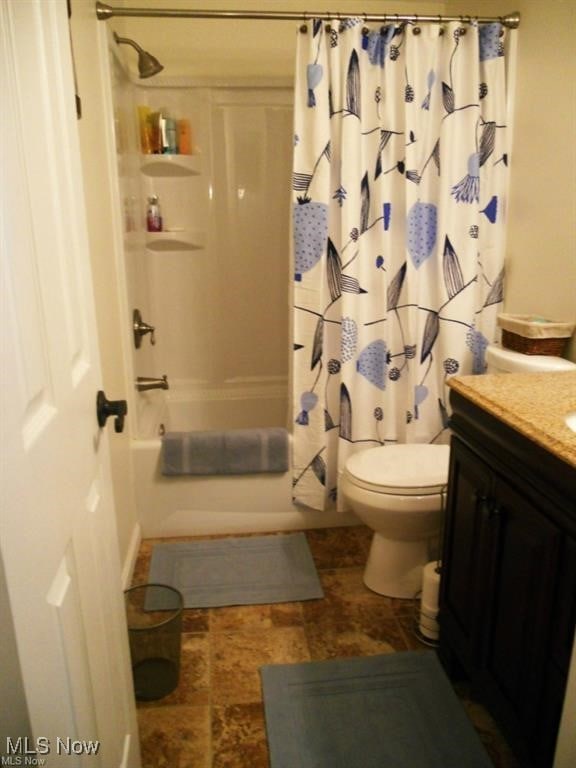2115 Presidential Pkwy Unit B5, Twinsburg, OH 44087 - full bathroom featuring vanity, toilet, shower / tub combo with curtain, and stone finish floors