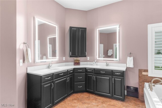 6170 Deer Spring Run, Canfield, OH 44406 - bathroom with double vanity, a bath, and tile patterned flooring