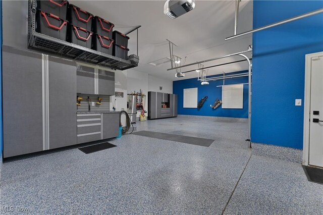 6170 Deer Spring Run, Canfield, OH 44406 - garage featuring a garage door opener
