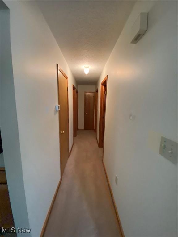 6234 W 54th St, Parma, OH 44129 - hallway featuring a textured ceiling