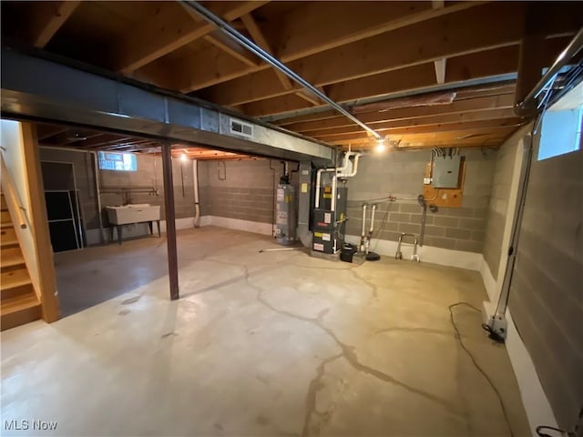 6234 W 54th St, Parma, OH 44129 - below grade area featuring water heater, a sink, heating unit, stairs, and electric panel