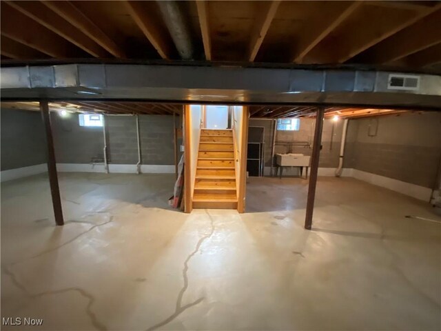 6234 W 54th St, Parma, OH 44129 - basement with stairway, a sink, and healthy amount of natural light