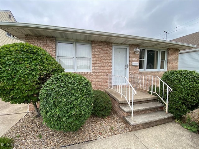 6234 W 54th St, Parma, OH 44129 - view of exterior entry featuring brick siding