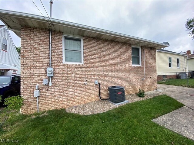 6234 W 54th St, Parma, OH 44129 - view of side of home with cooling unit and brick siding