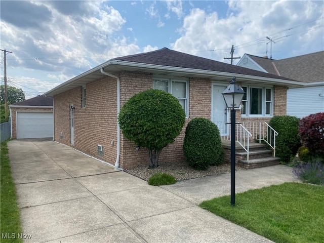 6234 W 54th St, Parma, OH 44129 - view of front of home featuring brick siding, an outbuilding, a shingled roof, and a detached garage