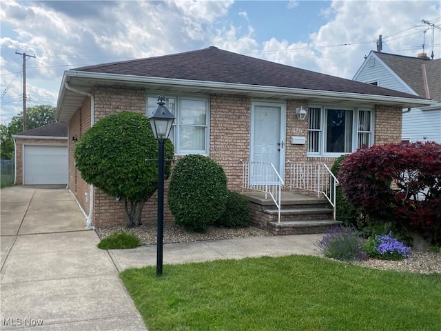 6234 W 54th St, Parma, OH 44129 - view of front of house featuring a shingled roof, brick siding, driveway, and a front yard