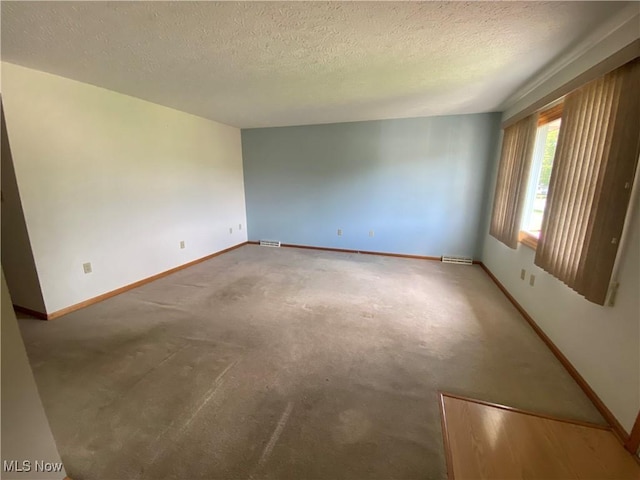 6234 W 54th St, Parma, OH 44129 - carpeted empty room featuring baseboards and a textured ceiling